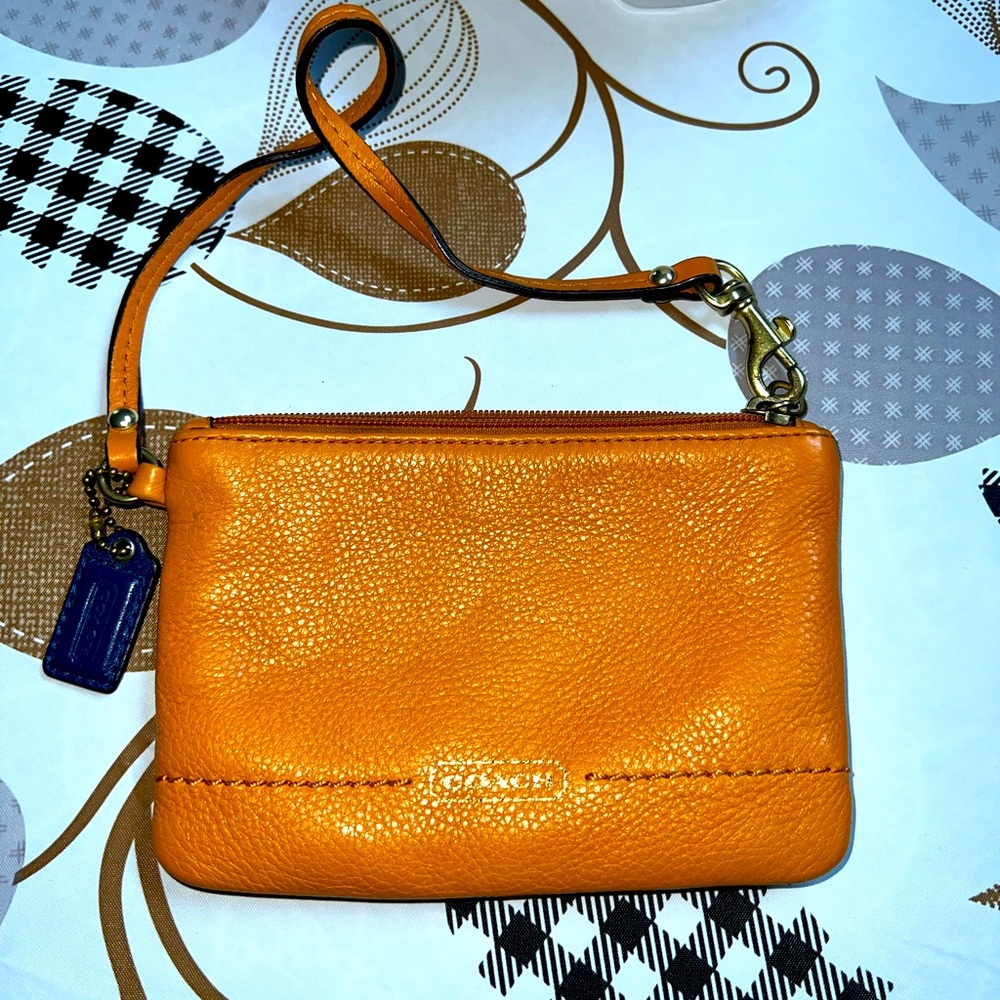 Coach orange leather wristlet